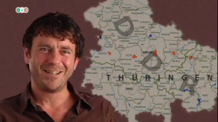 Nahaufnahme Mann, im Hintergrund Landkarte von Thüringen.
